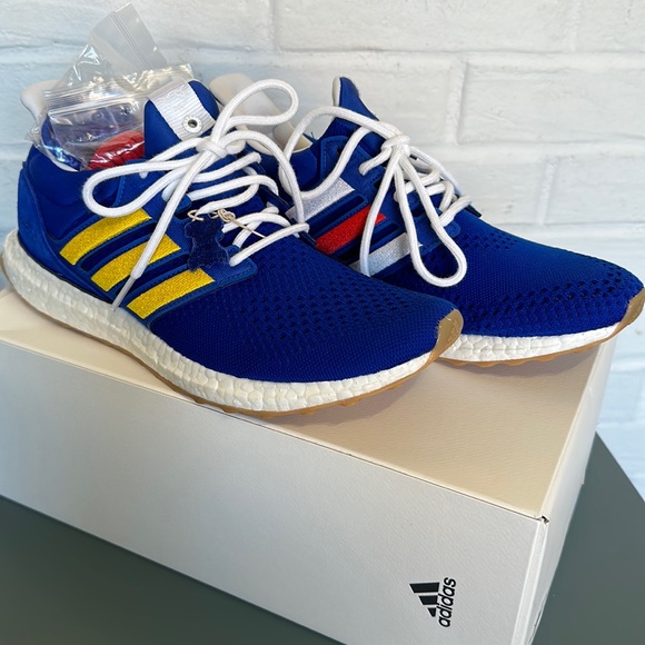 adidas Royal Blue Athletic Shoes with Yellow Stripes
